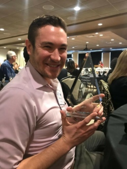 Image of Justin Bayer receiving award